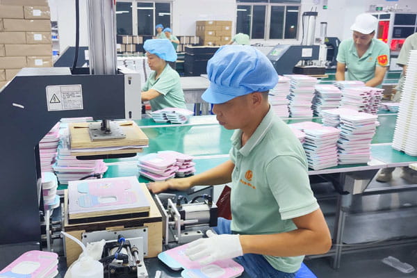 Operator on the laminated box production line in China